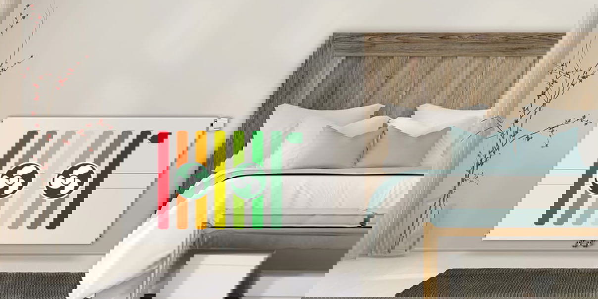 Wall-mounted Ulow E2 radiator next to a bed