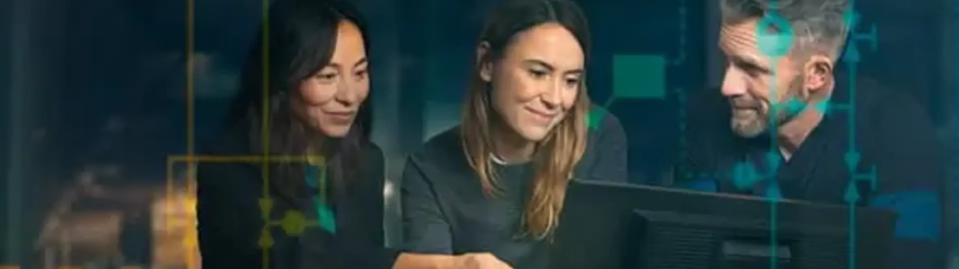 Team of 3 people glancing at a computer screen on how to install indoor climate