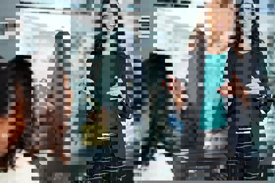 Woman explaining how to renovate the office with new radiators