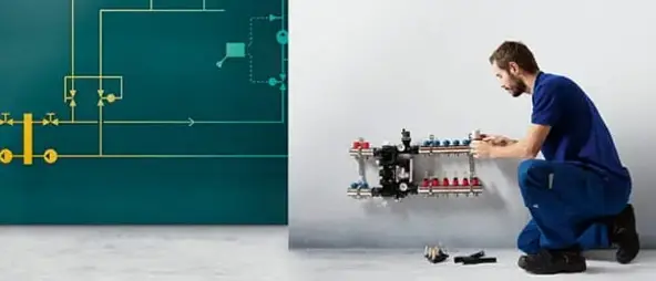 Installer installing a radiator into a indoor climate solution