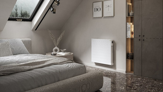 Oil-filled radiator wall-mounted in bedroom