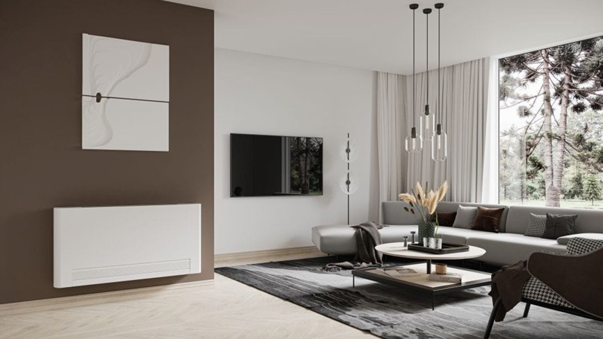 Modern living room with a sleek white fan convector radiator mounted on a brown accent wall.